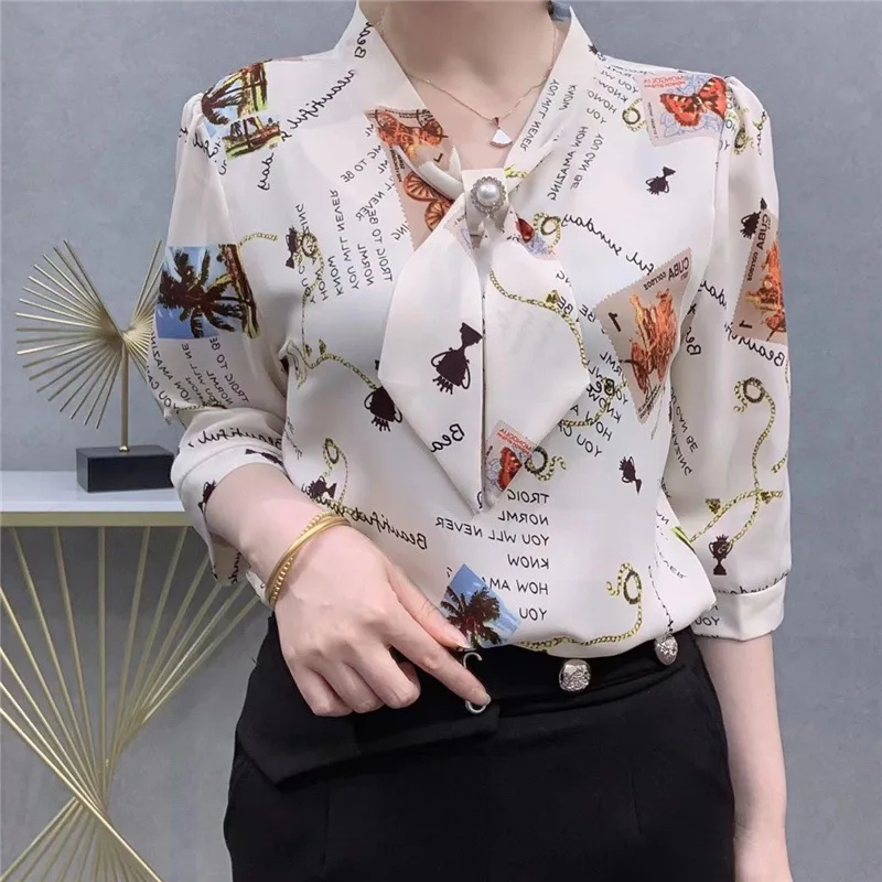 Bow Elegant Chic Fashion Blouse Women Casual Loose Floral Graffiti Print Three Quarter Sleeve Shirt Ladies Tops Blusas Mujer 4XL yada 2023 fashion cartoon graffiti umbrella sunny rain uv umbrella for women windproof manual three folding umbrellas ys200069