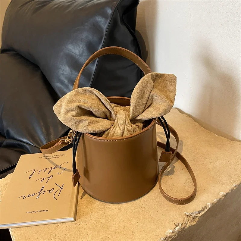 

New Women's Handbag Fashion Niche Design Bucket Bag PU Material Rabbit Ear Lace Up Design Shoulder Bag Free Shipping