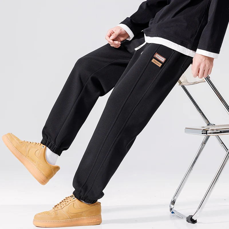 Spring Autumn New Solid Color Fashion Elastic Waist Sweatpants Man High Street Casual Loose Pockets Drawstring Cotton Trousers