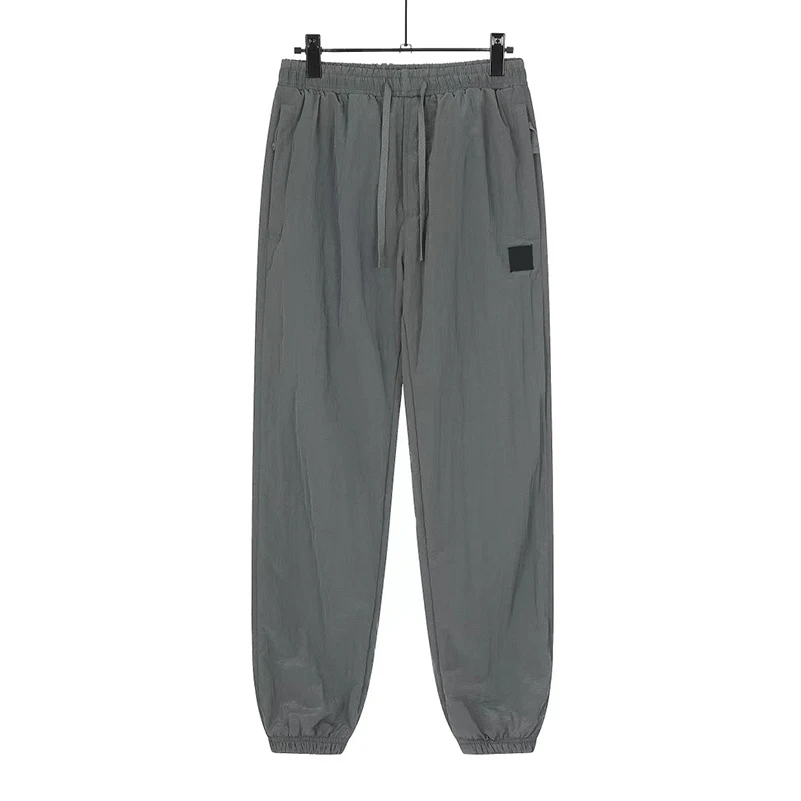 

Casual Pants Men Spring Summer Elastic Waist Techwear Streetwear Metal Pocket Nylon Woven Trousers Pantalones Hombre MA705