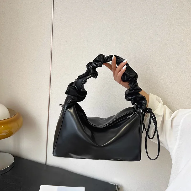 Niche design sense single shoulder cross-body fold armpit girl girl bag 2024 spring/summer new senior sense women's bag