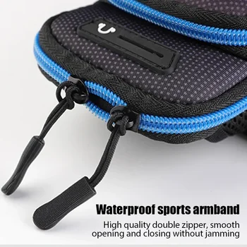 Detailed close-up view of the blue double zippers on a waterproof sports armband, showcasing smooth, jam-free opening and closing.