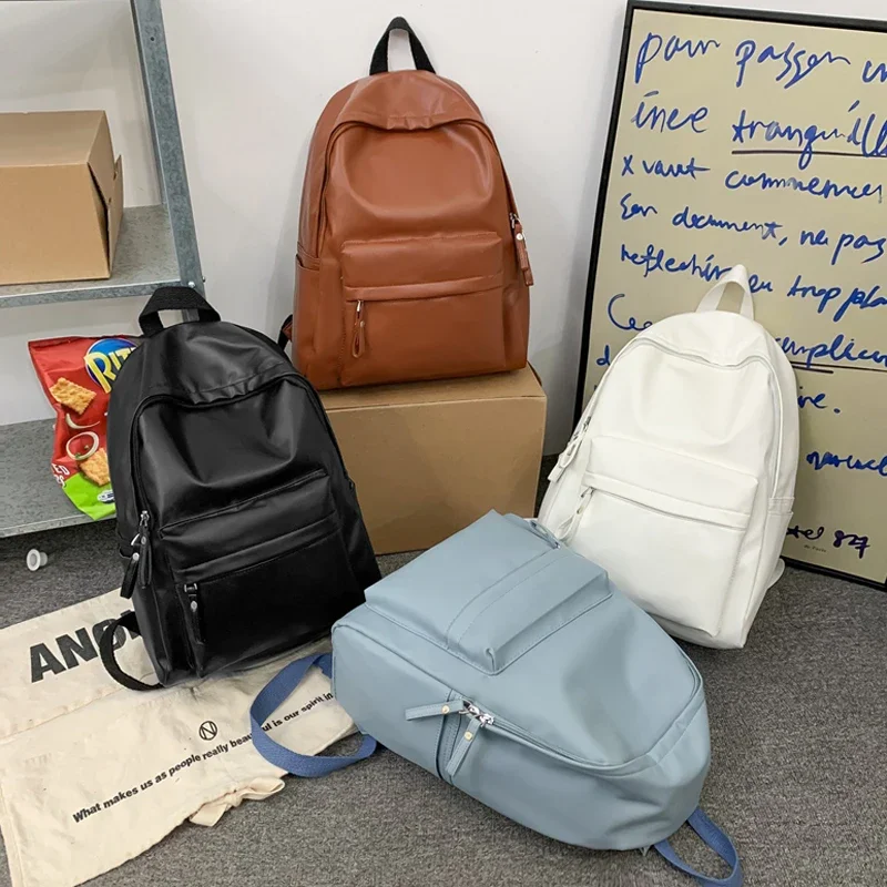 

High Quality Large Capacity New PU Retro Women Men Solid Color Couple Port Style Cool Travel BagPack School Backpack for Girls
