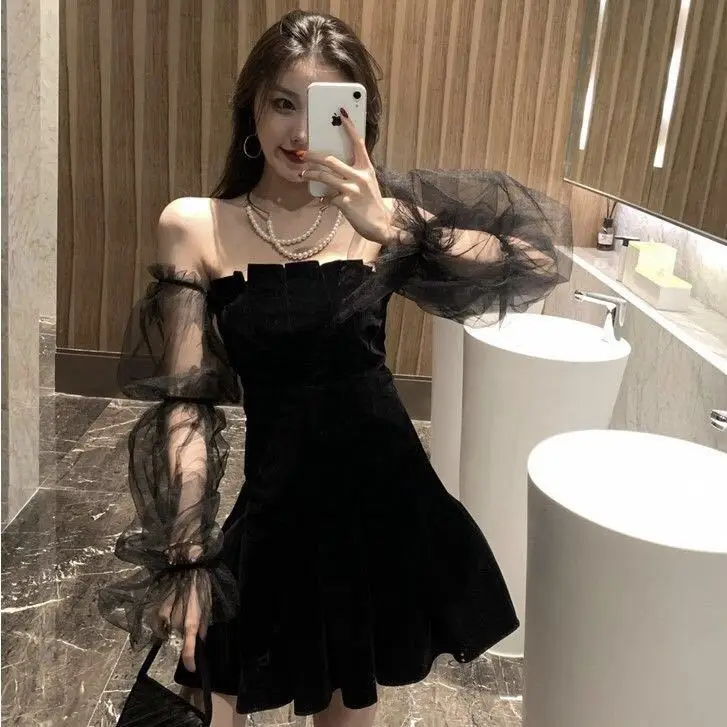 

Spring and Summer Temperament Mesh Gauze Bubble Sleeve Black Skirt Off-shoulder Fungus Tucked Waist Pommel Dress