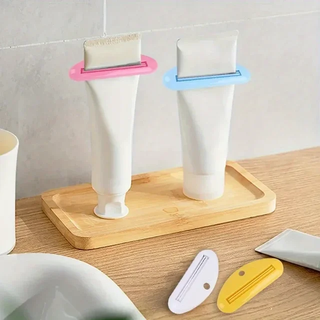 Spremi dentifricio in plasticaDispenser manuale per dentifricio, spremiagrumi multifunzionale indipendente per accessori da bagno 3