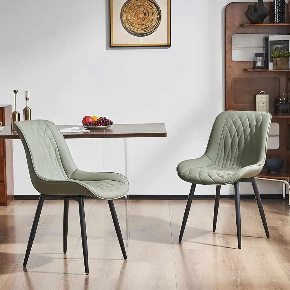 

2-piece set of faux leather upholstered dining chairs with metal legs and armless ergonomic backrest. Modern chairs