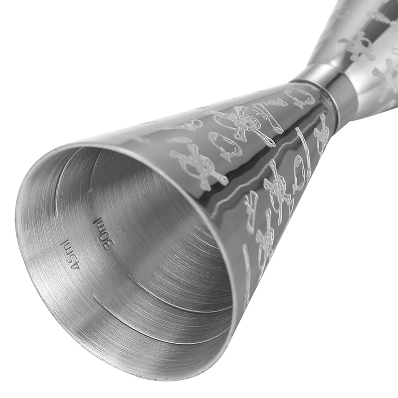 Assorted stainless steel cocktail jiggers for precise drink measurement in different sizes and finishes