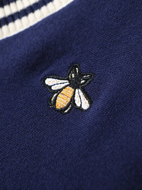 Elegant v-neck sweater with bee embroidery