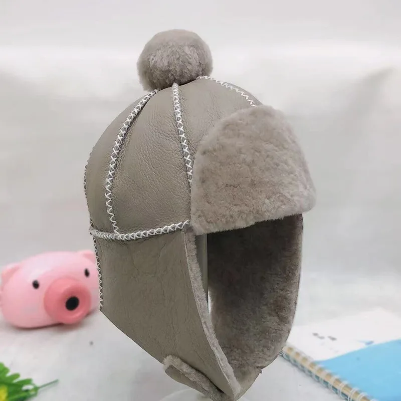Nette Kinder Mützen Echte Schafe Lammfell Pelz Kinder Junge Mädchen Bomber Hüte Winddicht Warme Winter Hut – Detail 1