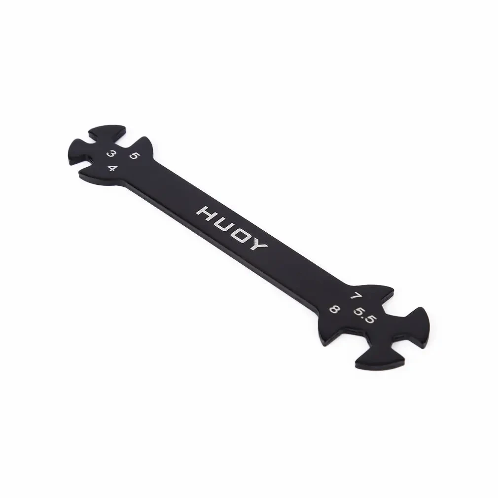 Main tenant la clé RC 6 en 1 pour drone, outil de serrage multifonction noir, montrant la prise en main ergonomique.