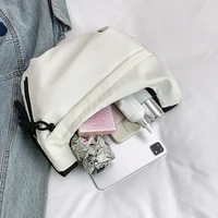 Neutral style tote bag with strap for carrying fitness items. New mini street-style handbag with shoulder strap. Lightweight and 3