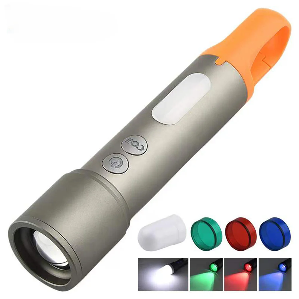 

White laser flashlight telescopic zoom USB rechargeable LED mini four light flashlight. A lamp with a key chain