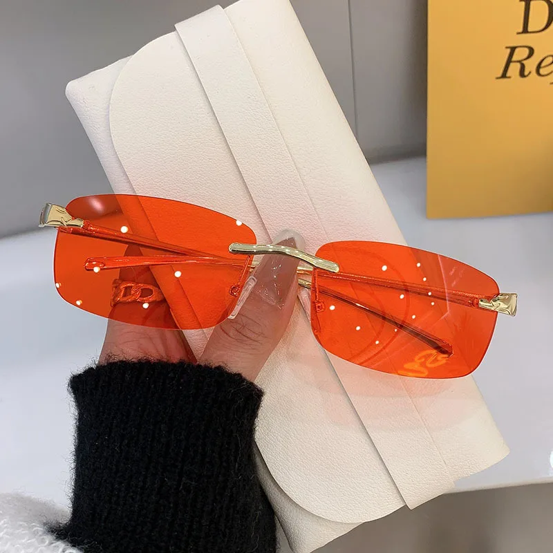 Stylish rimless rectangle sunglasses with tinted lenses and gold temples