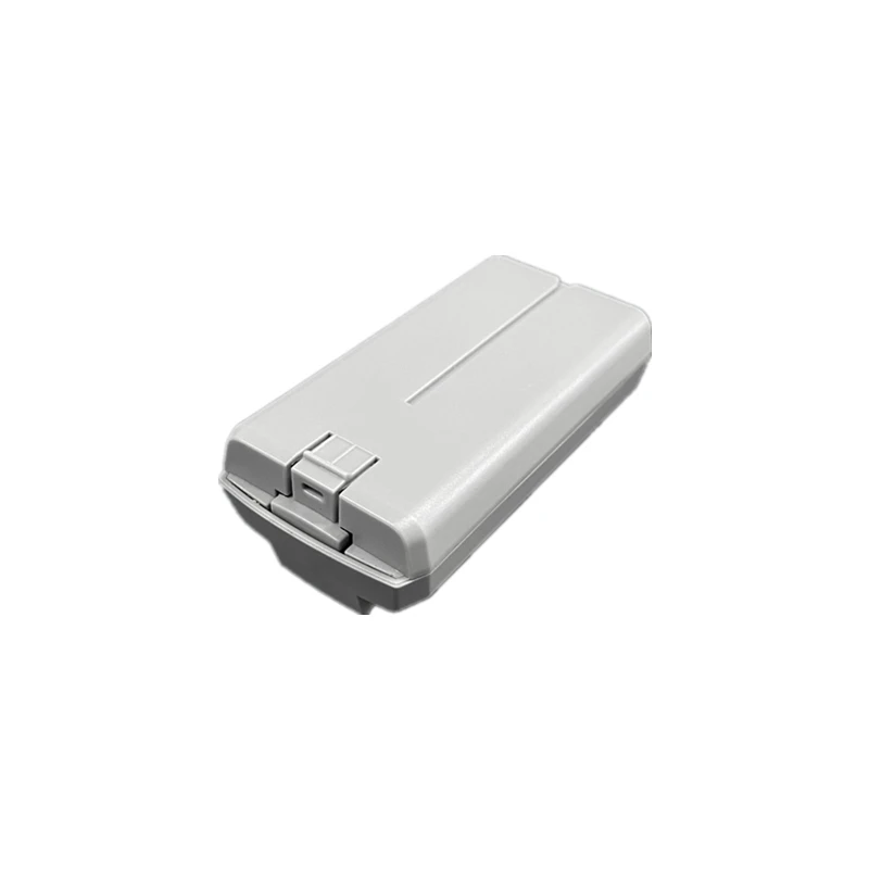 Vue de dessus de la batterie de vol intelligente pour DJI Mini 2 / SE / 4K, montrant les contacts et le design compact.