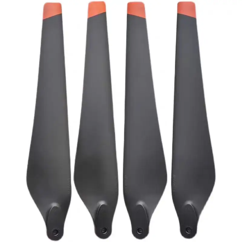 Hélices pliantes carbone R3820 pour DJI T30, posées sur fond blanc, pales dépliées