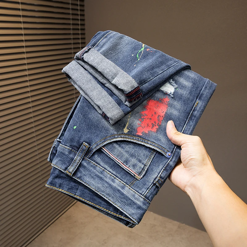 2024 New light luxury Blue MEN'S jeans fashion hole patches tide elastic slim embroidery spray paint straight casual denim pants