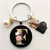 1 Elegant Women Alloy Initial Keychain with Imitation Pearl Vibrant Red Floral Design - Stylish Bag Charm & Perfect Gift for Her 5