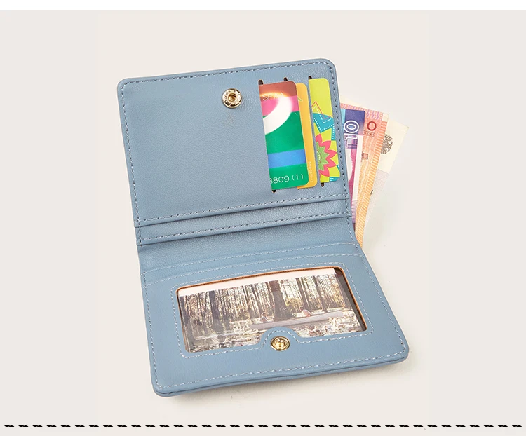 Short folding wallet size comparison in hand