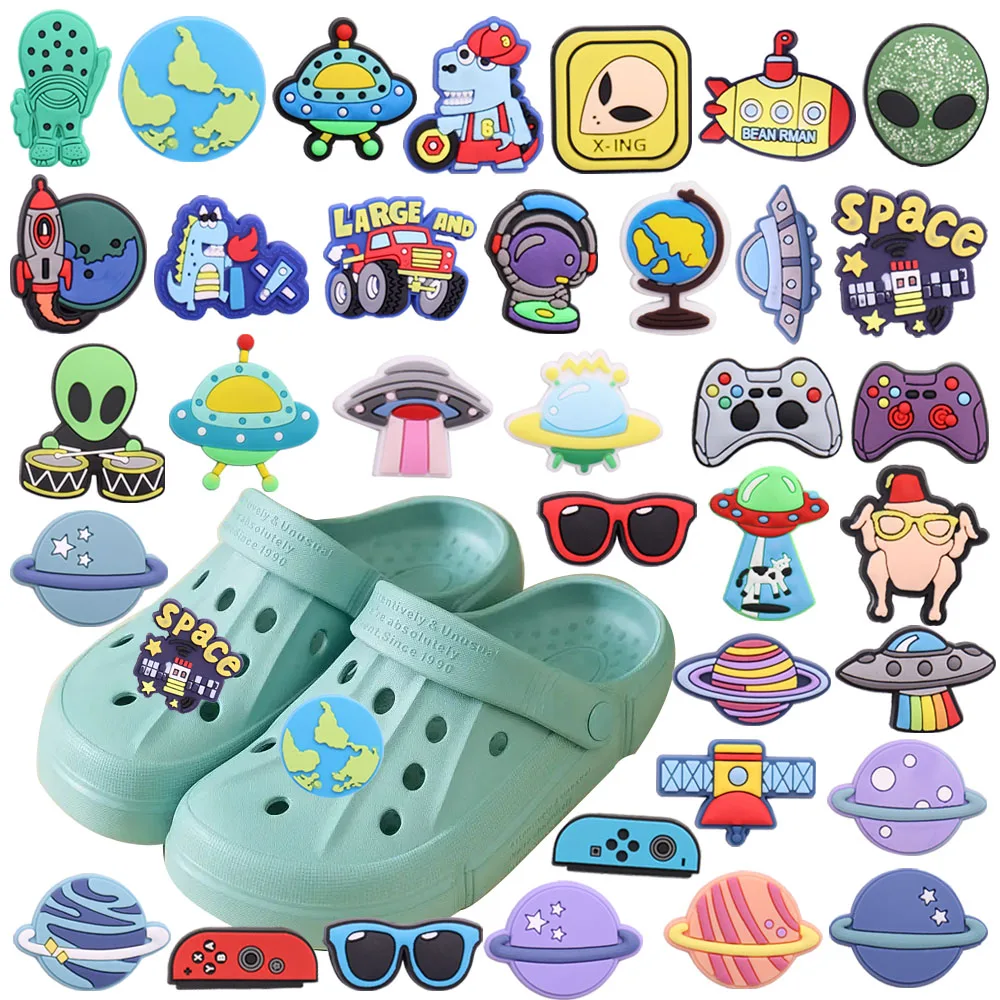 

Mix 50PCS PVC Planet Dinosaur Gamepad Alien Globe Glasses Rocket Large Car Croc Charms DIY Decorations for Bands Bracelets