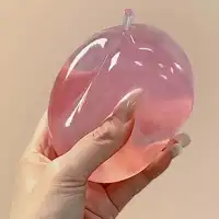 A Soft Pastel-Colored Crystal Apple With An Ultra-Thin Skin And A Smooth, Pliable Texture. It Is A Squeezable Stress Ball Toy As Well As A Tactile Sensory Toy. Ideal For Desktop Display And A Great Stress-Relieving Gift For The Office - Image 2