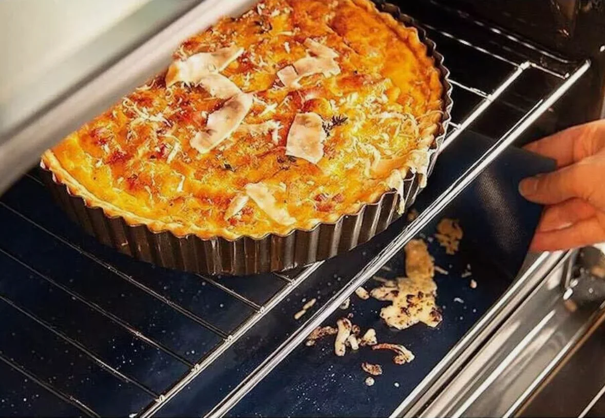 Reusable non-stick oven liner displayed flat on a surface