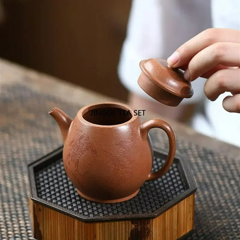 180ml Yixing Yixing Zisha teapot handmade figure pattern beauty tea infusion pot Kung Fu tea set