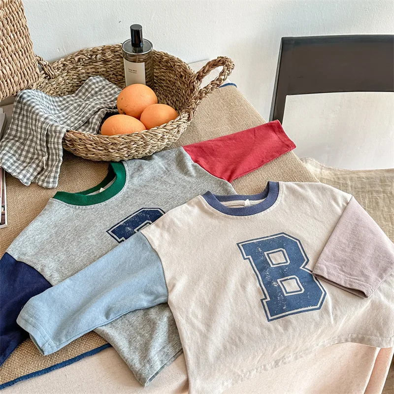 

2024 Spring Children's Color Blocked Long Sleeved T-shirt Boys Girls with Letter Printed Contrasting Loose Bottomed Shirt Top