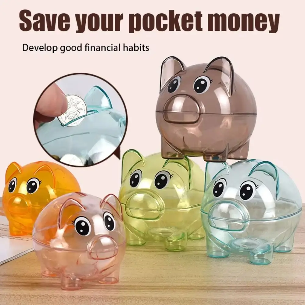 Cofrinho em formato de porco, transparente e reutilizável, com bandeja para moedas, ideal para incentivar o hábito de poupar._voghion.com