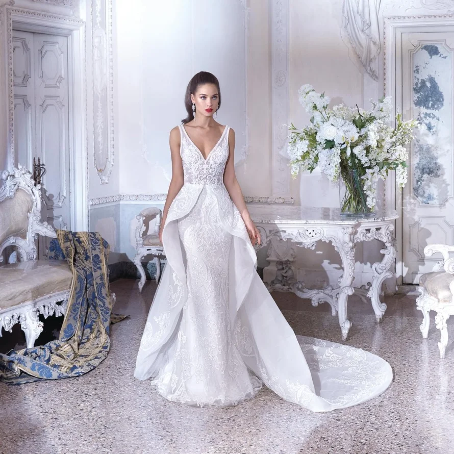 

Exquisite White Memraid Wedding Dresses Charming Lace Applique Sleeveless Bridal Gowns Sexy Backless Sweep Train Robes de Mariee