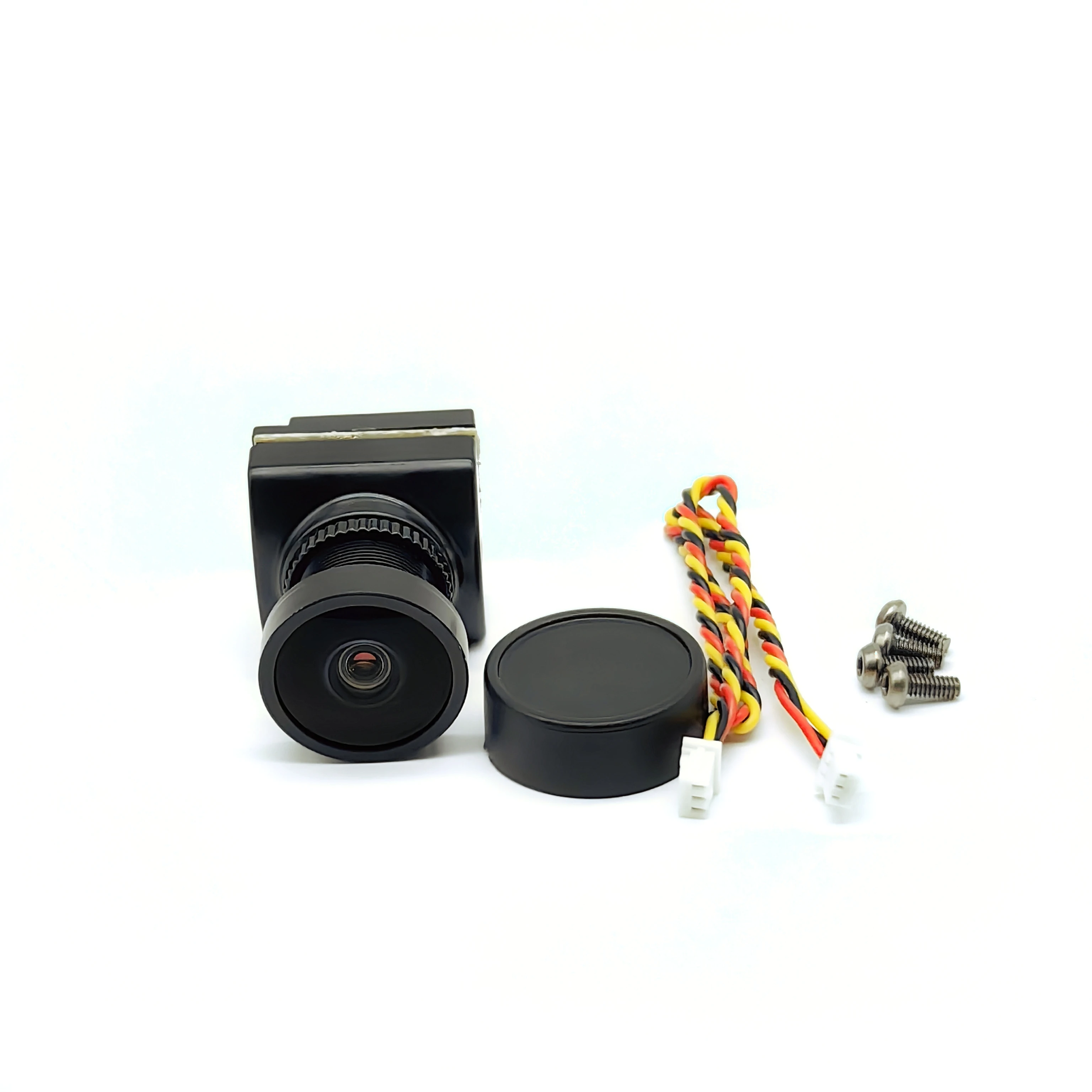 Vue de la caméra FPV 1800TVL 5MP 2.1mm Starlight dans son emballage, prête à être montée sur un drone de course.