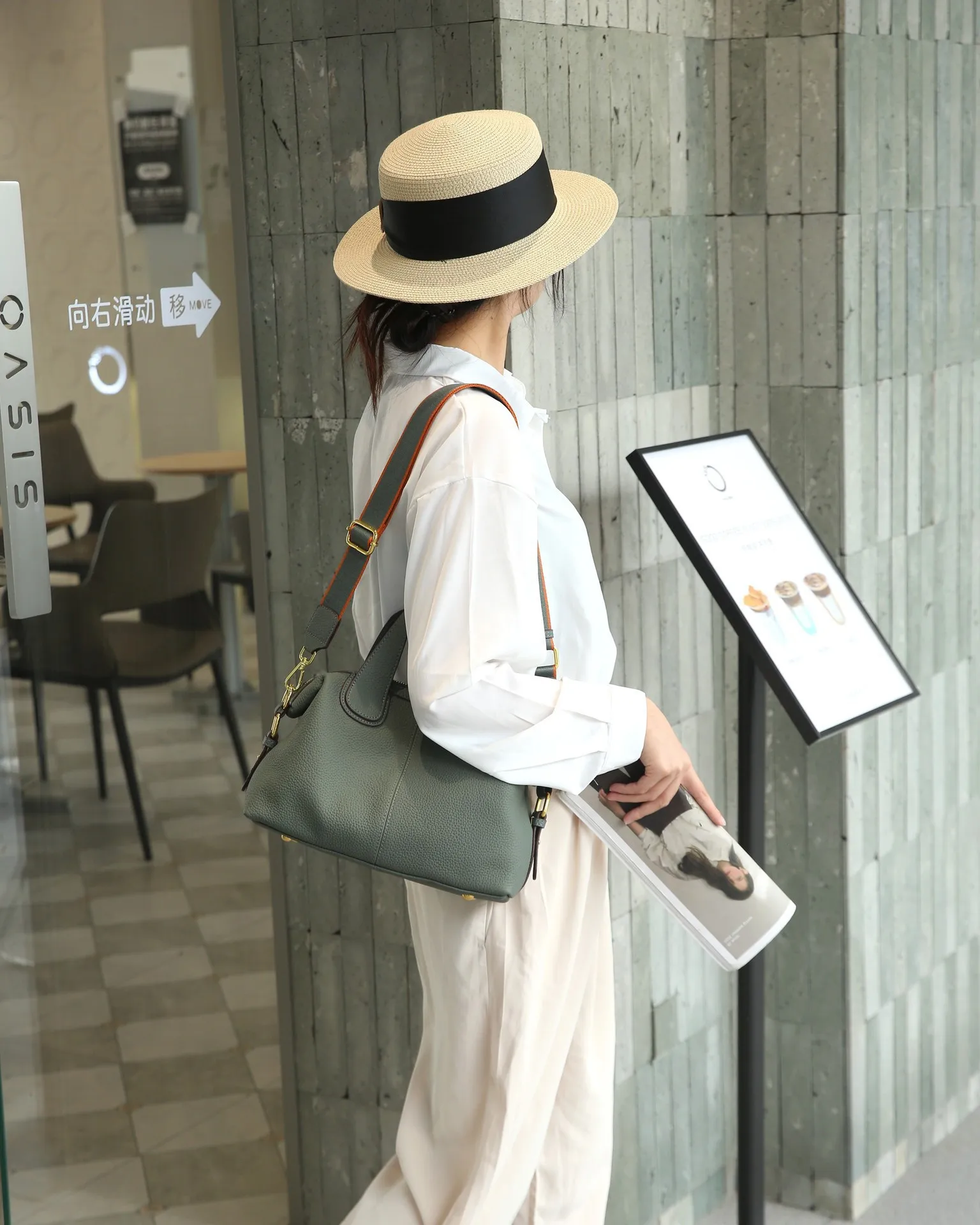 Elegant genuine leather crossbody handbag with shoulder strap and quality details