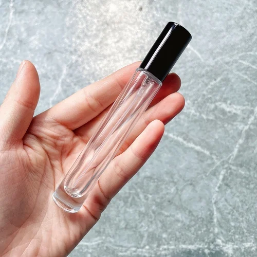 10ml perfume bottle in hand