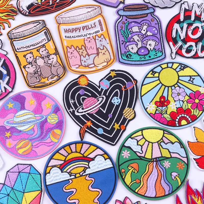Cartoon embroidery patches featuring space, floral, and animal themes – colorful iron-on patch set for DIY clothes and bags.
