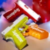 In summer, manually press the water gun to spray water with high pressure and long range, causing continuous water fights indoor 1