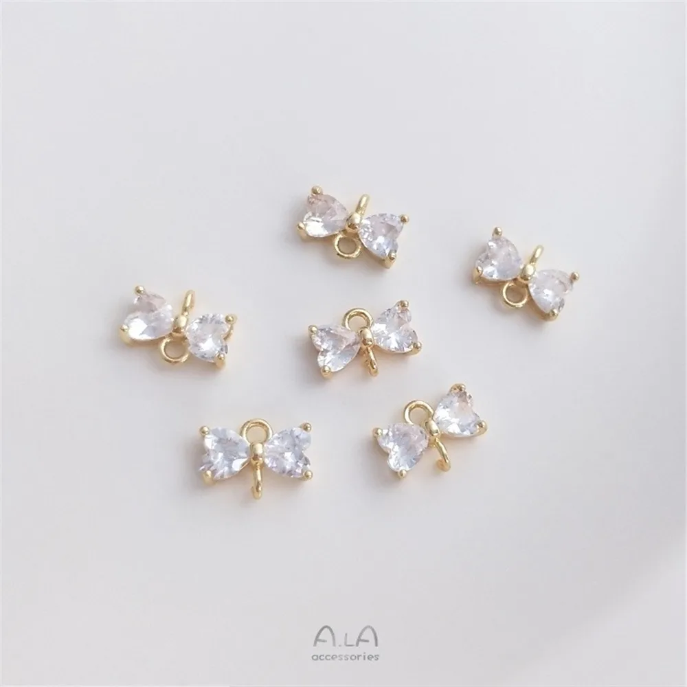 Рисунок 3 - Инкрустированный Цирконом бант из 14-каратного золота