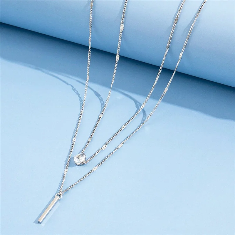 A trendy Crystal Geometric Women Charm Necklace with a sleek silver bar.