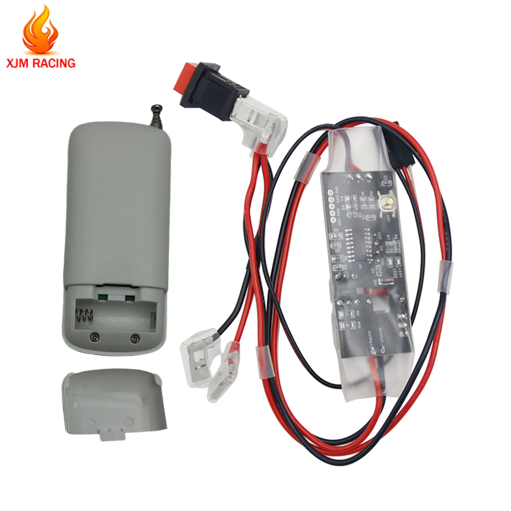 Interrupteur d'arrêt moteur RC 1/5 - Kill Switch avec télécommande, télécommande rouge et récepteur posés sur une surface blanche.