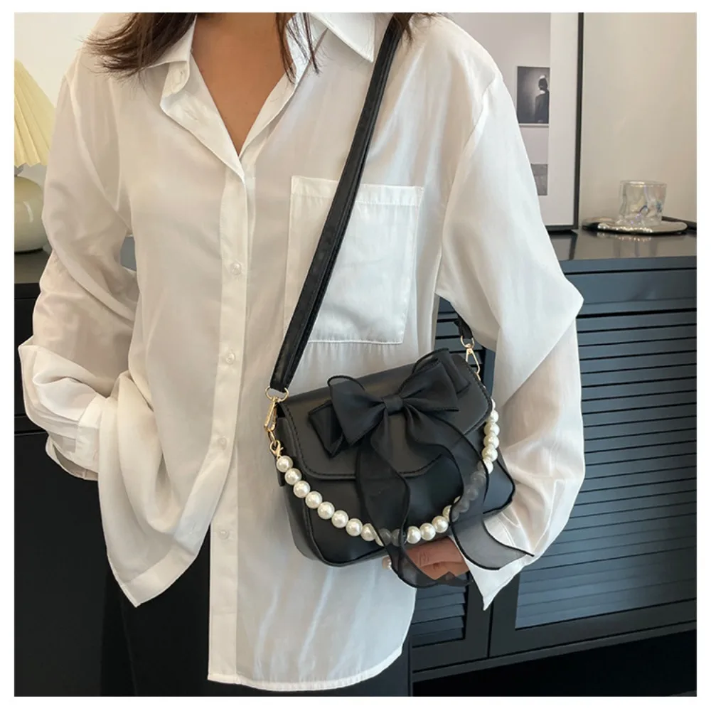 Schwarze Damen-Schultertasche im koreanischen Stil mit Schleife, Henkeltasche aus Canvas, große Achseltasche, Designer-Neuheit 2024_voghion.com