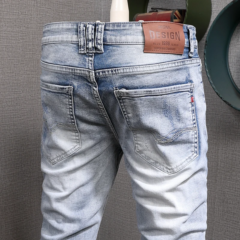 Newly Designer Fashion Men Jeans Retro Light Blue Elastic Slim Fit Destroyed Ripped Jeans Men Streetwear Hip Hop Denim Pants