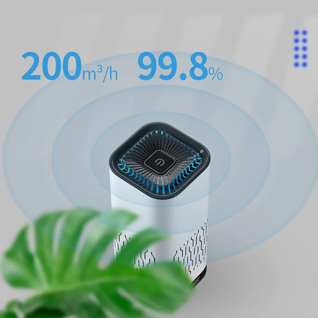 Purificateur d'air HEPA portable silencieux en fonctionnement dans un bureau, avec une plante à côté.