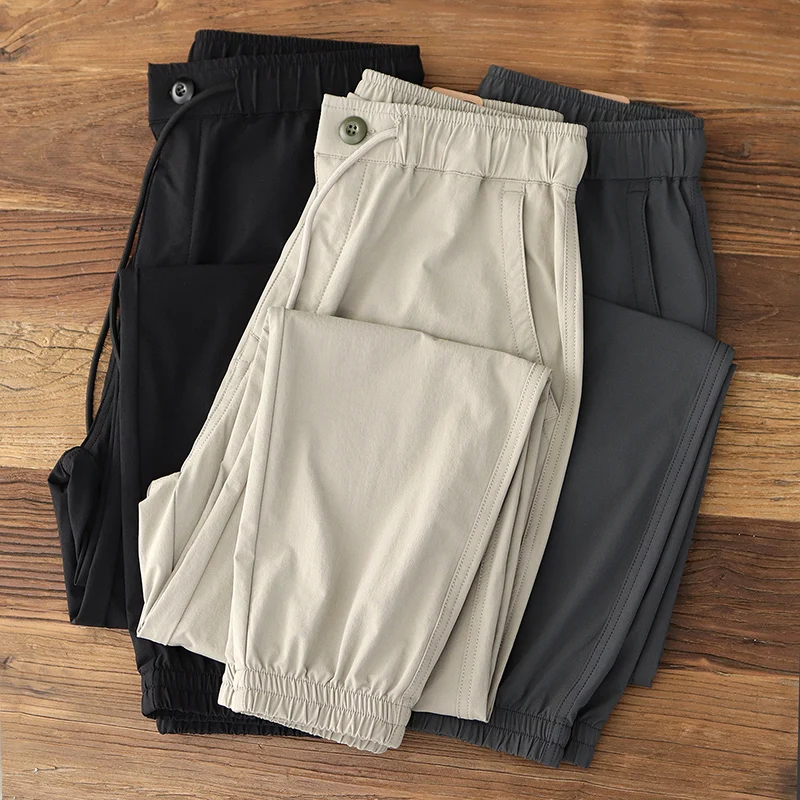 

Новинка лета, американские быстросохнущие легкие спортивные брюки-джоггеры из ледяного шелка на шнурке, мужские повседневные Прямые брюки с завязкой на щиколотке