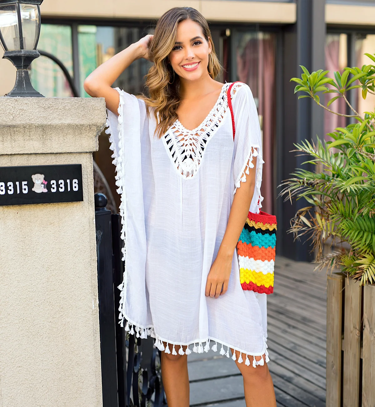 Women's hook splicing tassel sexy backless skirt loose split sun protection beach blouse 3012