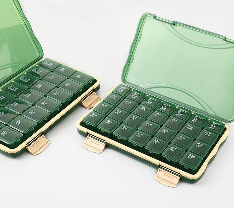 Multi color medicine box, portable for 7 days per week, with 21 compartments and 28 compartments for storage. Multi compartment