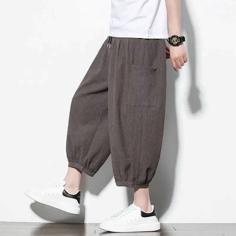 Fashion Elastic Lace Up Solid Color Pockets Harem Casual Pants Men's Clothing 2024 Spring Summer New Loose Korean Cropped Pants