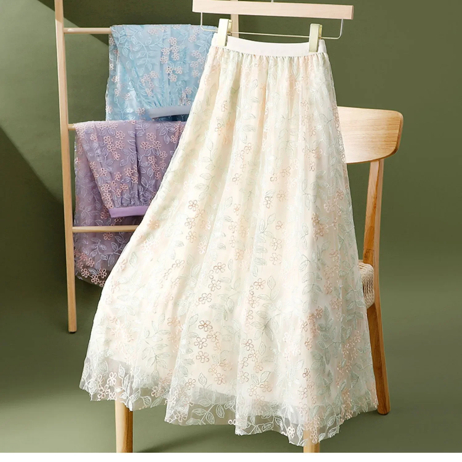Elegant embroidered floral sheer half skirt A-line midi umbrella skirt for women summer slimming big hemline polyester fibers.