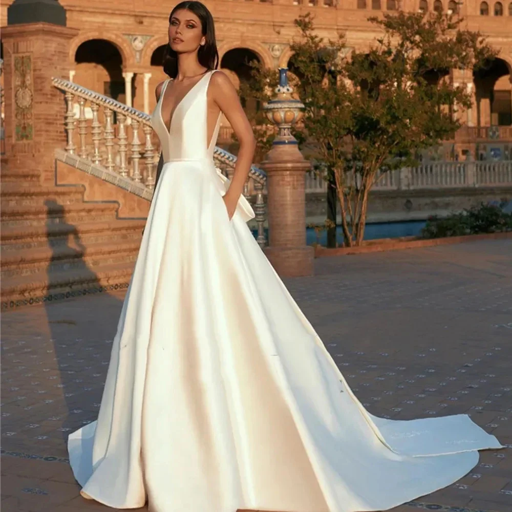 

Женское атласное свадебное платье-трапеция Flavinke, с глубоким V-образным вырезом, без рукавов, украшение с большим бантом и длинным шлейфом, 2025