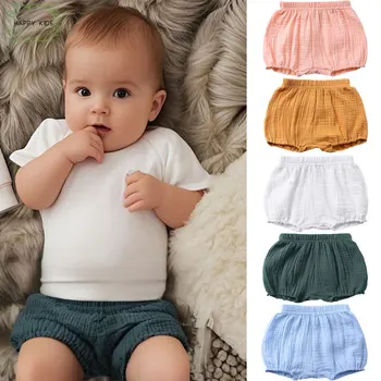 2025 Estate traspirante bambino bambini ragazzi ragazza pantaloncini tinta unita carino cotone lino pane pantaloni corti moda per neonati Bloomers 1