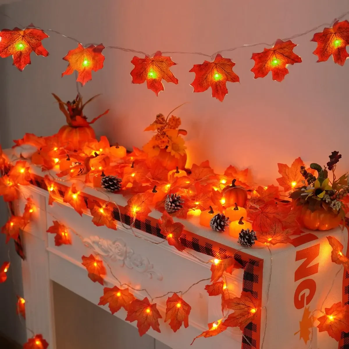 Weatherproof maple leaf lights on fence