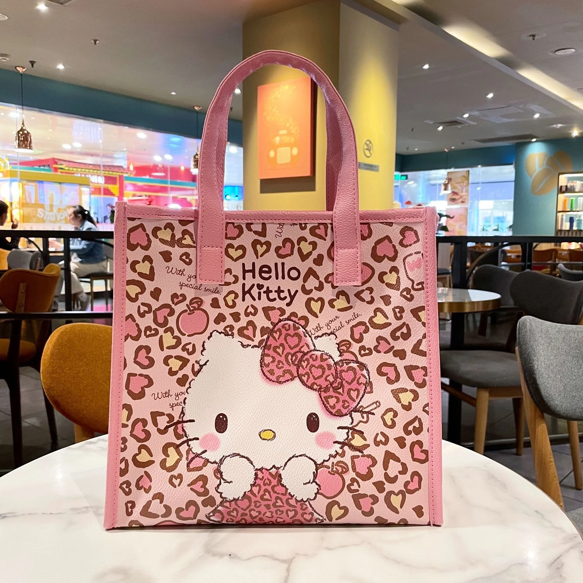 cheetah print hello kitty purse lightly used offers... - Depop