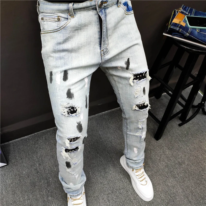 mens slim jeans Hole Blue Jean Pants Metal Rivet Patchwork Ripped Tights Jeans Men Brand European Jean Pant Men Slim Stretch Jean Denim Trousers cowboy jeans